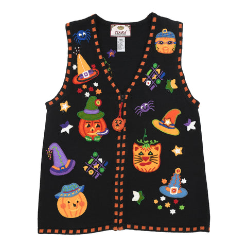 true vintage early 2000s black halloween theme sweater vest featuring hatted jack o lanterns, witch hats, spiders, cat jack o lantern and stars with center front V neck zipper shown on white background