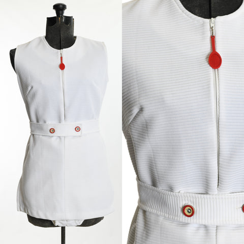 vintage 1970s white mini sleeveless tennis dress with front zipper and red tennis zipper pull charm matching belt with red white blue buttons and matching pantie covers shown on dress form left image with close up of bodice right image all on white background