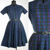 true vintage 1960s blue green purple plaid short sleeve full skirt midi dress with matching silver buckle green vinyl belt shown on dress form left image with close up of bodice belt right image all on white background