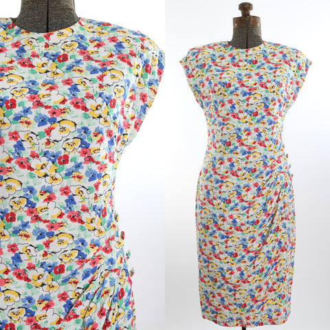 vintage 1980s does 40s white blue green yellow red pink dropped shoulder sleeveless faux wrap midi dress shown close up bodice left image with full dress on dress form right image all on white background