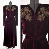vintage 1940s maroon red velvet gold soutache shoulder floral applique trimmed with blue glass beads with long sleeves and tie belt maxi dress shown full dress form left image and close up of bodice right image all on white background