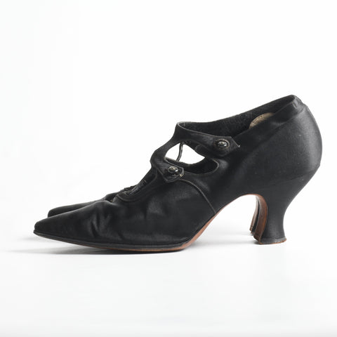1910s antique black silk satin pointy toed high heels, leather insoles, 2 glass buttons on straps that cage foot