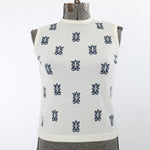vintage 1960s cream boucle sleeveless sweater shirt with navy tiki pattern print