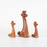 vintage 1950s brown poodle trio mother puppies with rhinestone eyes figurines side view