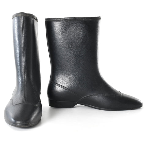 vintage 1960s black go go lined winter short boots with faux seam shown with left boot pointed forward and left boot shown from side on white background