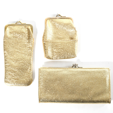 vintage 1960s gold vinyl 3 piece matching wallet, long and short cigarette case shown laying flat on white background
