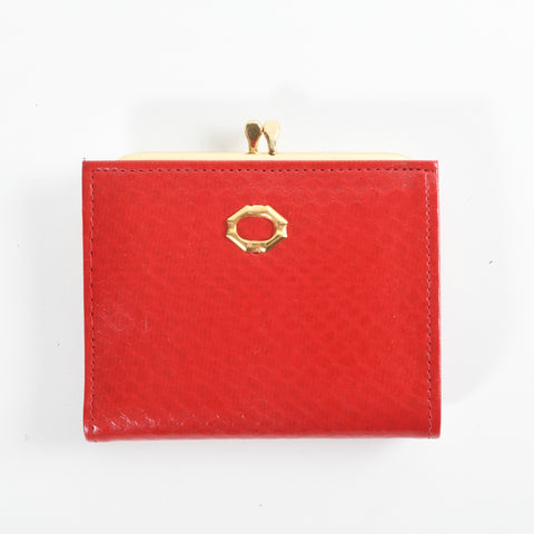 vintage 1960s red faux leather reptile skin print bifold snap closure wallet with top twist coinpurse shown lying flat on white background