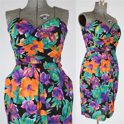 vintage 1980s tropical print strapless sun dress with bold orange purple flowers on black background and green foliage on black background, sweetheart neckline, boned bodice and pockets 