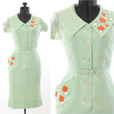 vintage 1950s mint green atomic oversized collar and flared pocket with white, bright orange, gold 3D trim