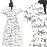 vintage 1970s white dress with zebra print zipper front short sleeve house dress by mister Robert