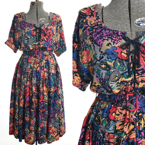 vintage 1980s watercolor floral dress with lace up bodice and full skirt and original belt shown on dress form on left with close up of left bodice on right of image